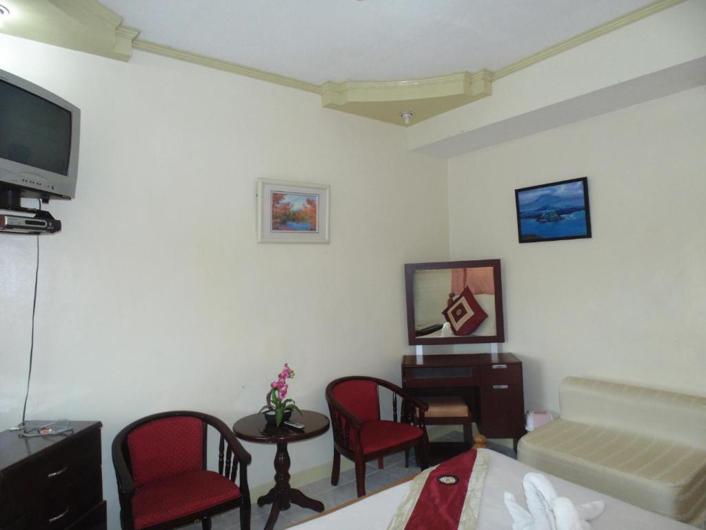 טגאיטאי Royal Taal Inn חדר תמונה